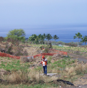Surveyor recording field measurements